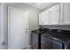 Laundry room with modern appliances and ample storage space at 115 W El Freda Rd, Tempe, AZ 85284