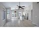 Open concept living space flowing into the kitchen with stainless appliances, an island and lots of natural light at 115 W El Freda Rd, Tempe, AZ 85284