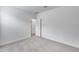 Bright bedroom featuring neutral carpet and white walls at 11574 W Luxton Ln, Avondale, AZ 85323