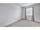 Bright, carpeted bedroom with neutral walls and a window with blinds at 11574 W Luxton Ln, Avondale, AZ 85323