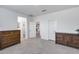 Bedroom featuring neutral carpet and multiple doors at 11574 W Luxton Ln, Avondale, AZ 85323
