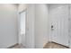 Entryway features a white front door and leads into a carpeted room at 11574 W Luxton Ln, Avondale, AZ 85323