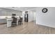 A spacious open-concept design featuring a kitchen with gray cabinets, a quartz island, and stainless steel appliances at 11574 W Luxton Ln, Avondale, AZ 85323