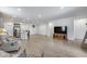This open-concept design features a kitchen with a large island that flows into the spacious living area at 11574 W Luxton Ln, Avondale, AZ 85323