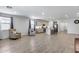 Spacious living area flows into the kitchen area offering lots of natural light, perfect for entertaining or quiet relaxation at 11574 W Luxton Ln, Avondale, AZ 85323