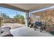 Covered patio with concrete floor, grill and privacy lattice at 11574 W Luxton Ln, Avondale, AZ 85323