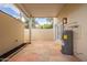 Large back patio features tiled flooring, a modern exterior door, and neutral paint at 1301 N 44Th St, Phoenix, AZ 85008