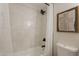 Bright bathroom featuring a shower over tub, framed art, and modern black hardware at 1301 N 44Th St, Phoenix, AZ 85008