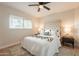Cozy bedroom featuring a comfortable bed, ceiling fan, and plush rug at 1301 N 44Th St, Phoenix, AZ 85008