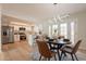 Open dining area adjacent to the kitchen, features modern lighting and access to outdoor space at 1301 N 44Th St, Phoenix, AZ 85008
