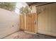 The property includes a well-kept exterior with wood gate and neutral paint at 1301 N 44Th St, Phoenix, AZ 85008