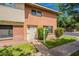 Two-story townhouse with brick and siding, a well-kept lawn and front door at 1301 N 44Th St, Phoenix, AZ 85008