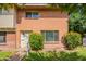 Charming brick townhouse with lush green lawn and colorful bushes at 1301 N 44Th St, Phoenix, AZ 85008