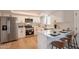 Modern kitchen with white cabinets, stainless steel appliances, and breakfast bar at 1301 N 44Th St, Phoenix, AZ 85008