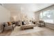 Bright living room features modern decor, light wood floors, and a cozy seating arrangement at 1301 N 44Th St, Phoenix, AZ 85008