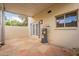 Spacious covered patio with stone flooring, exterior door, and updated water heater at 1301 N 44Th St, Phoenix, AZ 85008
