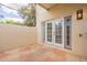 Private outdoor patio with stone flooring and access to the home at 1301 N 44Th St, Phoenix, AZ 85008