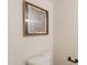 Modern toilet with black hardware and contemporary art at 1301 N 44Th St, Phoenix, AZ 85008