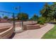 Community basketball/tennis court entrance with adjacent buildings and landscaped walkway at 1351 N Pleasant Dr # 2051, Chandler, AZ 85225
