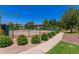 Well-maintained community tennis/basketball court surrounded by lush greenery and walking path at 1351 N Pleasant Dr # 2051, Chandler, AZ 85225