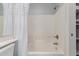 Bright white bathtub with showerhead and curtain at 1351 N Pleasant Dr # 2051, Chandler, AZ 85225