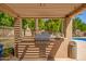 Outdoor barbeque area, perfect for entertaining poolside with resort-style desert landscaping at 1351 N Pleasant Dr # 2051, Chandler, AZ 85225