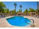 Stunning community pool features resort-style desert landscaping and comfortable outdoor seating at 1351 N Pleasant Dr # 2051, Chandler, AZ 85225