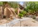 Beautiful stucco condo with mature shade trees and lush landscaping around the sidewalks at 1351 N Pleasant Dr # 2051, Chandler, AZ 85225