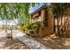 Beautiful stucco condo with mature shade trees and lush landscaping around the sidewalks at 1351 N Pleasant Dr # 2051, Chandler, AZ 85225
