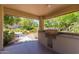Outdoor grilling area with a built-in grill and countertops for outdoor cooking at 1351 N Pleasant Dr # 2051, Chandler, AZ 85225