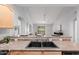 Open kitchen with stainless sink, and views to the open living area at 1351 N Pleasant Dr # 2051, Chandler, AZ 85225