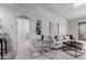 Bright, open-concept living area featuring modern decor, vaulted ceiling, and seamless flow to dining area at 1351 N Pleasant Dr # 2051, Chandler, AZ 85225