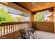 Relaxing covered patio with a wrought iron table and chairs at 1351 N Pleasant Dr # 2051, Chandler, AZ 85225