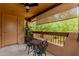 Covered patio area with outdoor seating and view of lush greenery at 1351 N Pleasant Dr # 2051, Chandler, AZ 85225