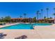 Resort style community pool features ample lounge chairs and well-manicured landscaping at 1351 N Pleasant Dr # 2051, Chandler, AZ 85225
