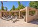 Community poolside lounge area with outdoor furniture, barbeque, and desert landscaping at 1351 N Pleasant Dr # 2051, Chandler, AZ 85225