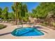 Community spa with a metal safety rail and steps in a relaxing, landscaped community at 1351 N Pleasant Dr # 2051, Chandler, AZ 85225