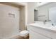 Modern bathroom boasts a walk-in shower with tile surround and a sleek vanity with white countertop at 13611 N 98Th Ave # D, Sun City, AZ 85351
