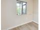 Bright room featuring modern wood-look floors and a window at 13611 N 98Th Ave # D, Sun City, AZ 85351