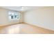 Bright bedroom with ample natural light and ceiling fan, features laminate wood flooring at 13611 N 98Th Ave # D, Sun City, AZ 85351