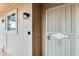 Secure front entrance featuring a storm door, updated lighting, and a small awning at 13611 N 98Th Ave # D, Sun City, AZ 85351