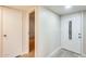 Bright entryway with white door featuring decorative glass and neutral color palette at 13611 N 98Th Ave # D, Sun City, AZ 85351