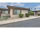 Charming home with mature landscaping and a low-maintenance gravel front yard in a tranquil setting at 13611 N 98Th Ave # D, Sun City, AZ 85351