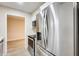 Stainless steel refrigerator and oven, modern cabinets and quartz countertops at 13611 N 98Th Ave # D, Sun City, AZ 85351
