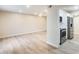 Living room with modern floors leads to the kitchen with stainless steel appliances at 13611 N 98Th Ave # D, Sun City, AZ 85351