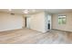 Spacious living room features modern wood-look floors, recessed lighting and a ceiling fan at 13611 N 98Th Ave # D, Sun City, AZ 85351