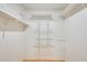A well-organized walk-in closet features custom shelving and ample storage space at 13611 N 98Th Ave # D, Sun City, AZ 85351