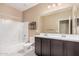 Bathroom featuring double vanity, tub and shower combo creating a luxurious space at 1367 S Country Club Dr # 1327, Mesa, AZ 85210