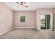 Standard sized bedroom with carpet, fan, small window and sliding door to patio at 1367 S Country Club Dr # 1327, Mesa, AZ 85210