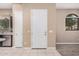 Bright entryway features tile flooring, a white door and view into the kitchen at 1367 S Country Club Dr # 1327, Mesa, AZ 85210